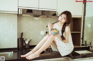 A woman holding a frying pan with a piece of pizza in it.