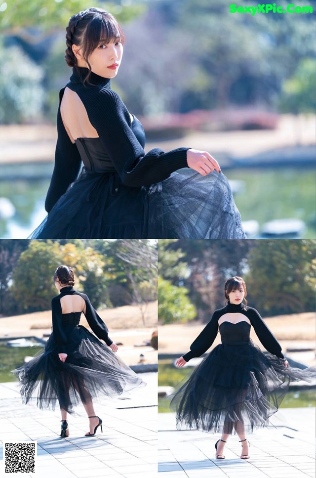 A woman in a black dress is posing for a picture.